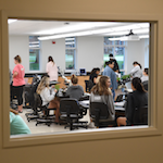 Students in classroom at Sage Hall